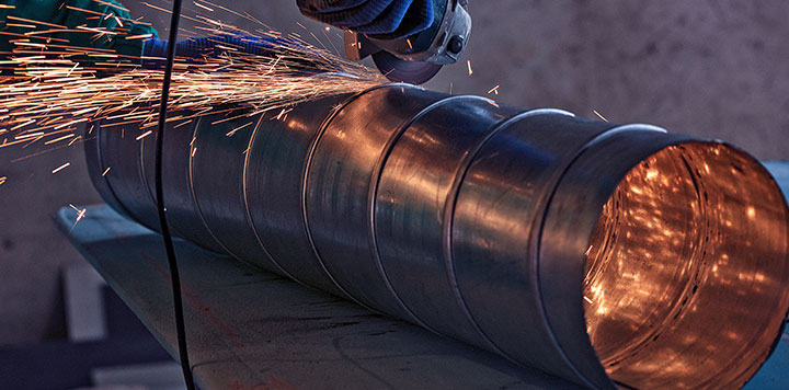 Grinding down a large HVAC component for custom fabrication