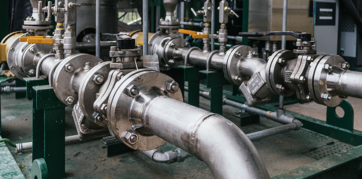 Close up of metal pipes with pipe fitting components