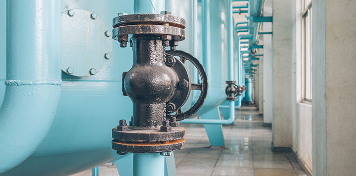 Close up of plumbing equipment in industrial setting